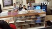 Ariana Grande licks donuts in shop and says she 
