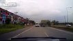 Thailand Dashcam catches a van driver cutting off a semi and forcing it off-road to avoid the collision.