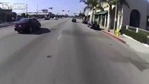Biker Accidentally Scares The Crap Out Of Red Light Runner
