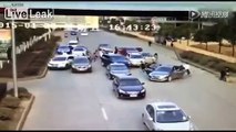Two groups of gangsters with sugar cane machetes fight each on busy street