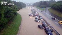 Asshole drivers hit water causing splash to stuck drivers on the other side