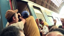 Migrants storm re-opened Budapest train station