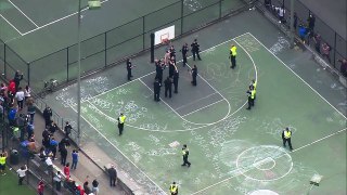 Seattle Police remove uncooperative man from basketball hoop