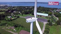 Drone pilot spots man sunbathing on top of wind turbine 200ft