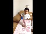 Little kid show amazing skill in balancing pot on head