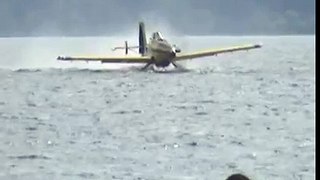 Air Tractor AT-802F Fire Boss seaplane hits water with prop