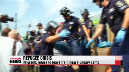 Refugee crisis continues in Europe as trains are stopped in Hungary
