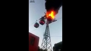 The moment when cable car getting burned while on ride