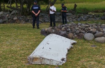 France says wing part found on Reunion island definitely from MH370