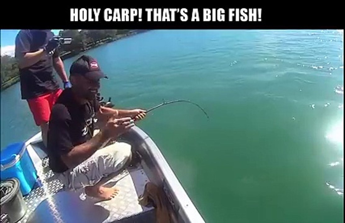 This guy reels in a massive 9-foot catfish...