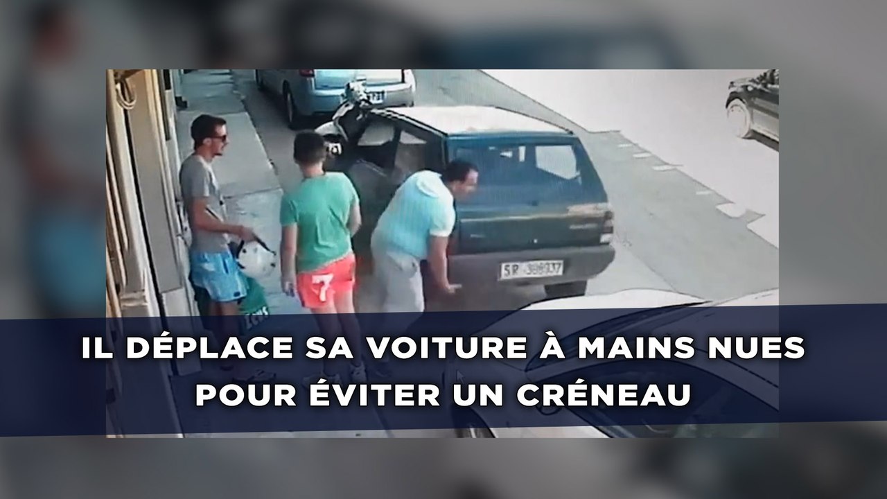 Il déplace sa voiture à mains nues pour sortir d'une place de stationnement