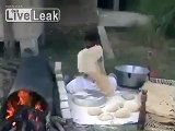 A man making very big Bread (roti) in pakistan