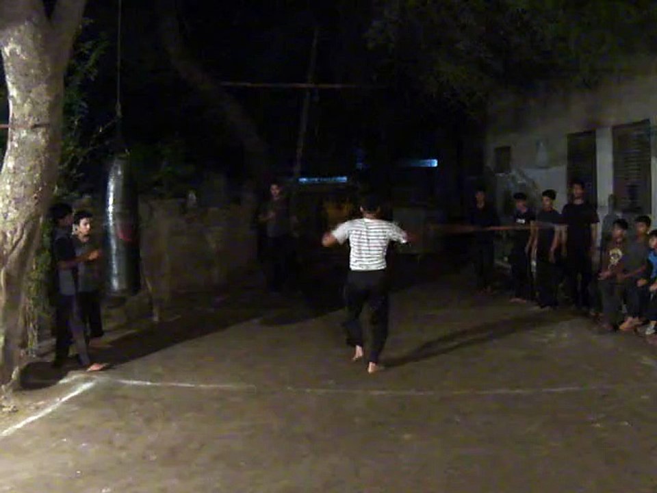 Boy Perform Stick in New Dragon Club