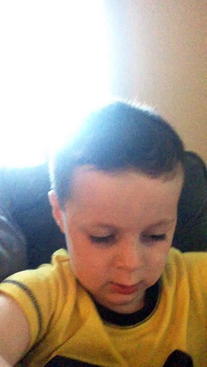 Cute kid has a song in his head.