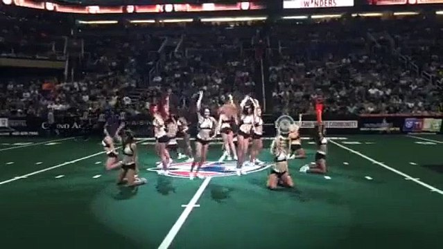 Burly Football Player Crashes Cheerleaders' Routine And Steals The Show