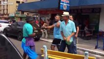 Street fight between a crazy hobo and a german tourist with fedora.