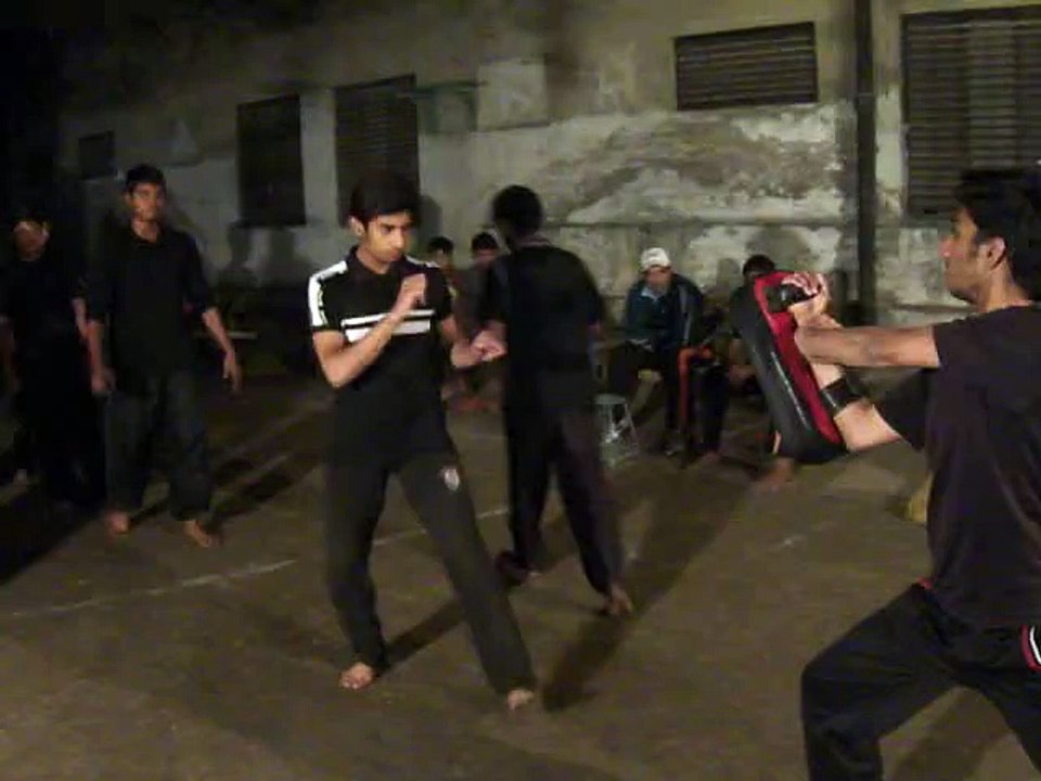 Boys Practice Back Kick in New Dragon Club