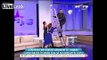 Romanian TV presenter falls off ladder live