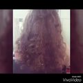 curls of hair using hair straighteners plate