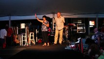 Carol Light and Dick Groeb talk to the tent crowd at Elvis Week 2015