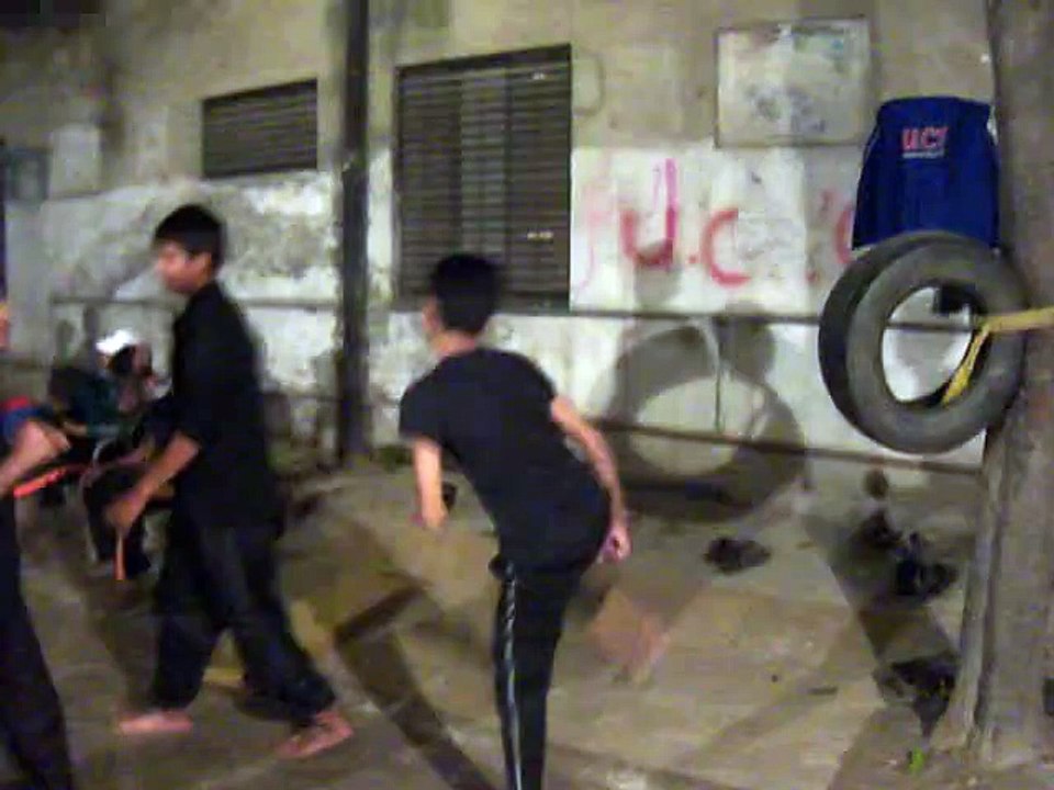 Boys Practice Kicks In New Dragon Club