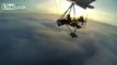 Flight on a Motorized Hang Glider Above the Clouds