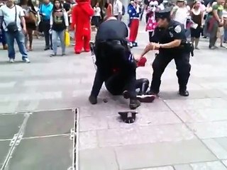 Spider-Man panhandler punches cop in Times Square
