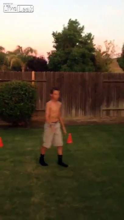 Kid gets knocked out by water balloon while dad laughs