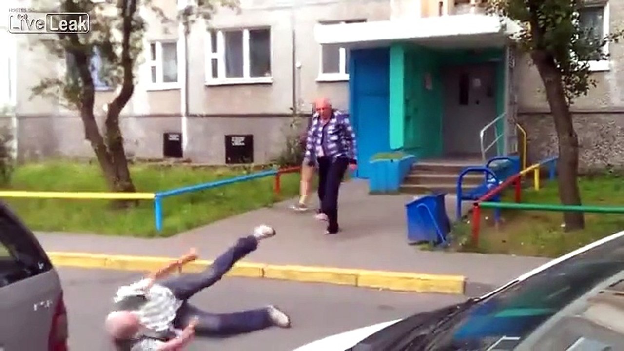 Three old men have a fight in the street