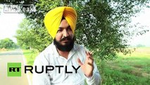 India: Turban-meister! See man wrap turban on moving motorcycle
