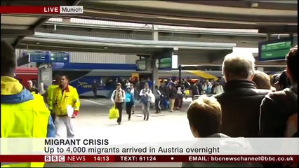 Welcome to Germany - People applaud and greet migrants with gifts as they arrive in Munich