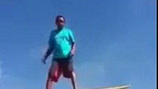 Dumb guy surfing on a roof... Epic Fail