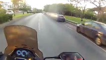 Cop biker goes flying in the air trying to run a red light
