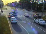 Traffic Camera Catches Mini Smart Car Slamming into Police Cruiser at intersection causing injuries