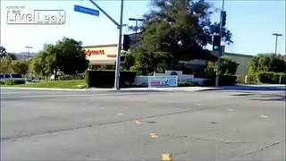 Car stops in middle of traffic. Bonus clip of not so smart bicyclist.
