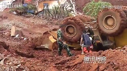 Driver trapped under front loader with foot borken