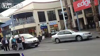 Topless "woman" goes pshycho, climbs on cars...