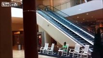 Chinese guy slides down the escalator Fail!