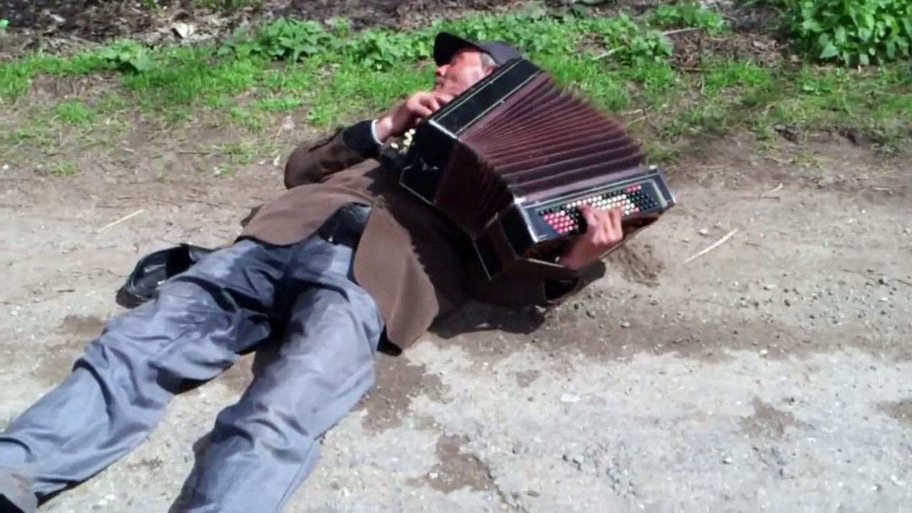 Drunk russian musician playing the accordion