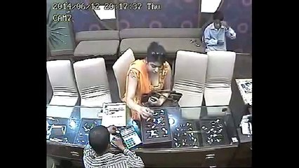 CCTV-Asian Lady steals Jewellery In A Shop