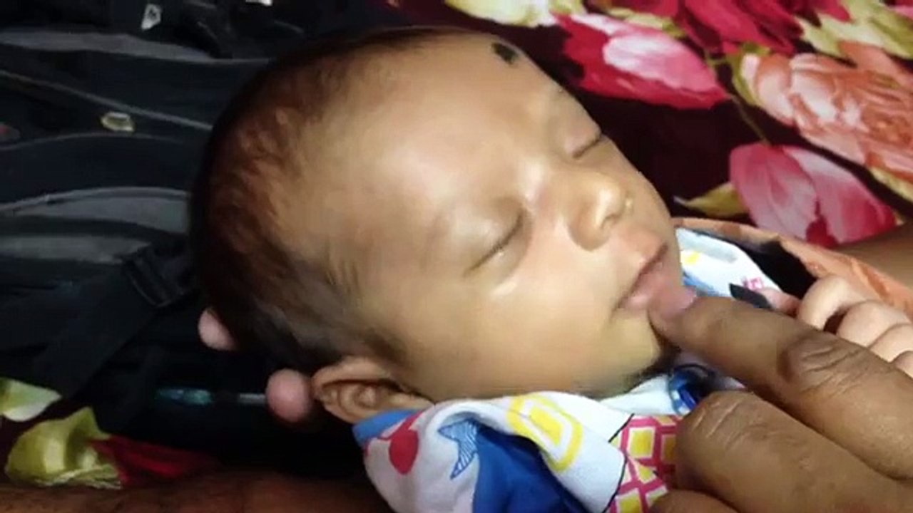 teasing irritating cute little sleeping baby