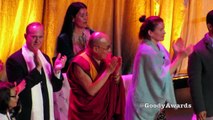 Michael Franti hugs at Dalai Lama 80th Birthday Celebration