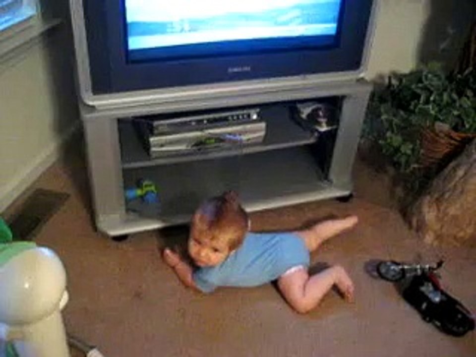 Playing in the entertainment  center.