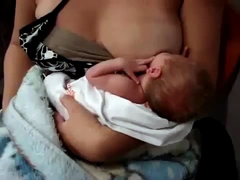 beautiful Mother Breastfeeding A Newborn