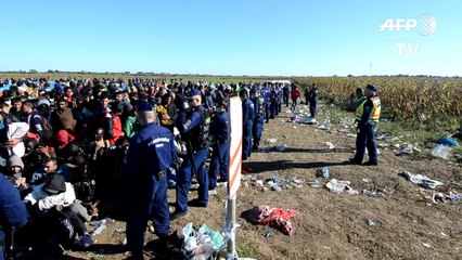Migrants try to escape from Hungary camp as tension rises