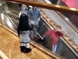 The girl says goodbye everyone escalators so cute