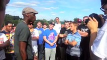 Small white rapper destroys tall black rapper in rap battle