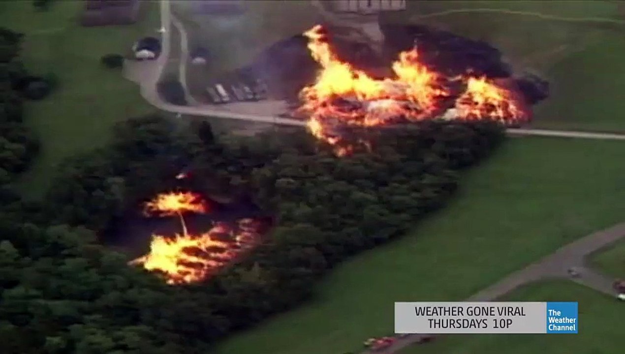 Incredible fire tornado : 3 millions liters of Whiskey burning in lake after lightning strike destroyed a warehouse