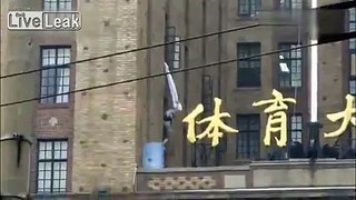 Wife's boyfriend hangs and swings off building when husband unexpectedly comes home