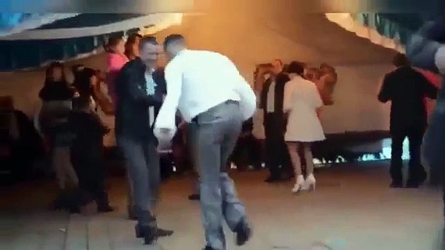 Very drunk guy dancing at a wedding